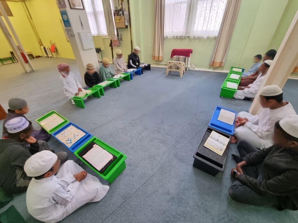 Boys reading Qur'an in a circle